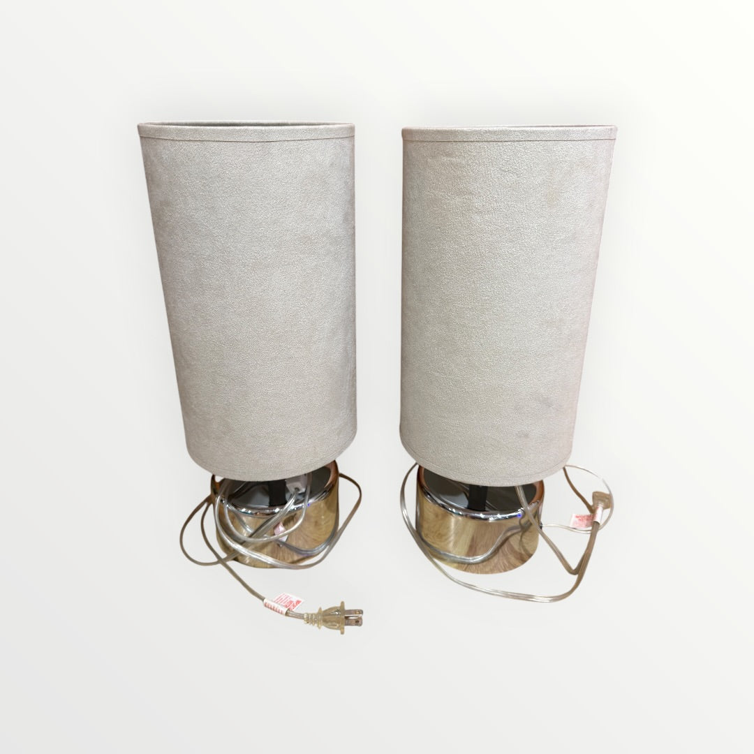 A Pair of Mid-Century Modern Chrome table Lamps with Cylindrical Beige Shades 7"D x 17"H