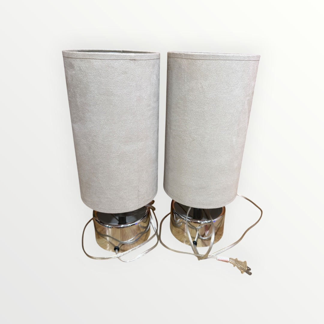 A Pair of Mid-Century Modern Chrome table Lamps with Cylindrical Beige Shades 7"D x 17"H